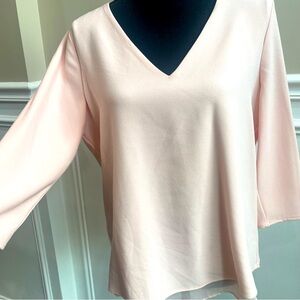 Peach colored V neck blouse